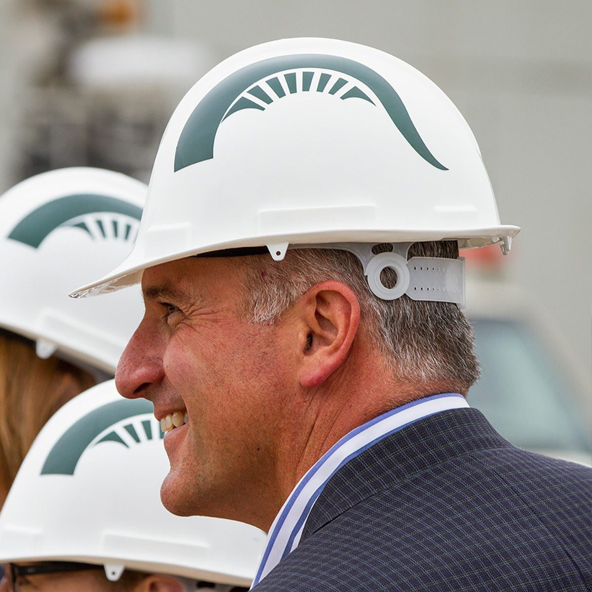 Construction helmets with Sparty plume graphic decal