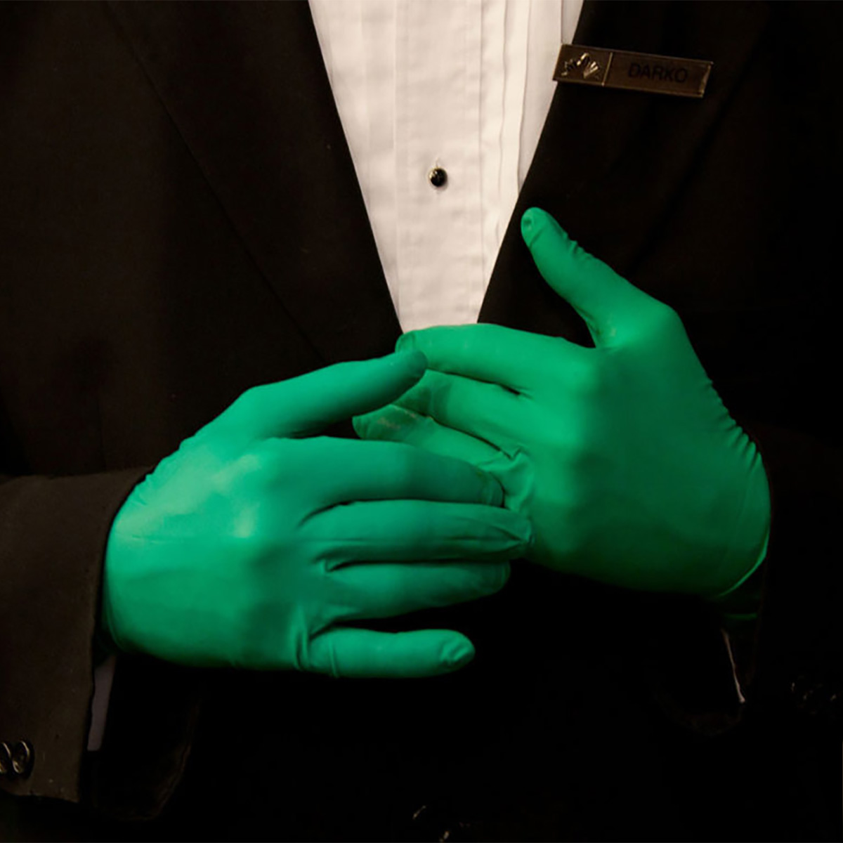 MSU College of Human Medicine Gala promotional image. Green gloves. 