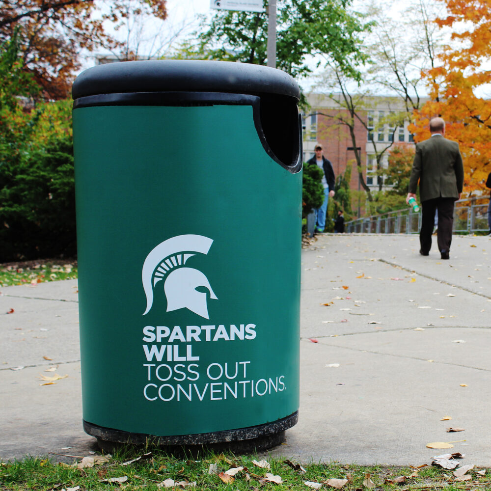 Trash can wrap with headline "Spartans will toss out conventions."