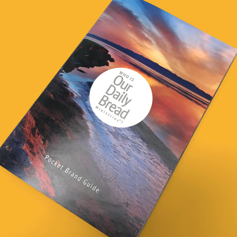 Pocket brand guide designed for Our Daily Bread Ministries. The cover features a photo of a beach at sunset.