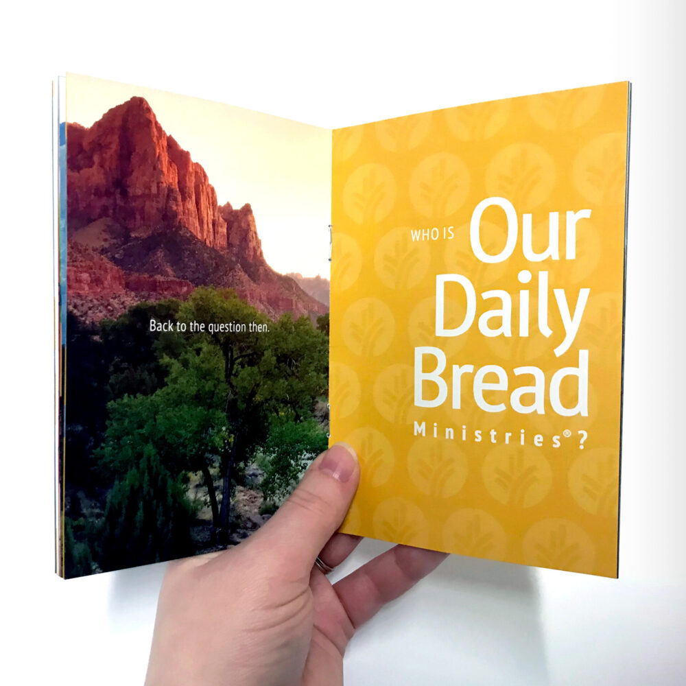 Pocket brand guide. An inside spread featured a mountain and yellow repeated logo. The line reads, “Who is Our Daily Bread Ministries?”