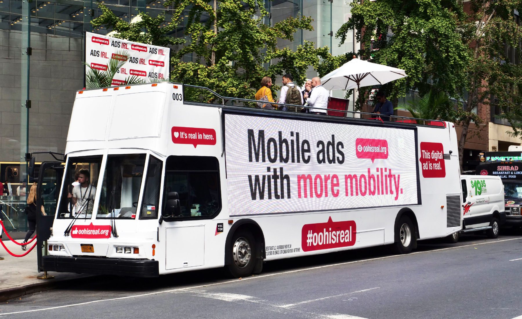 Bus out of home mobile advertisement with headline "Mobile ads with more mobility"