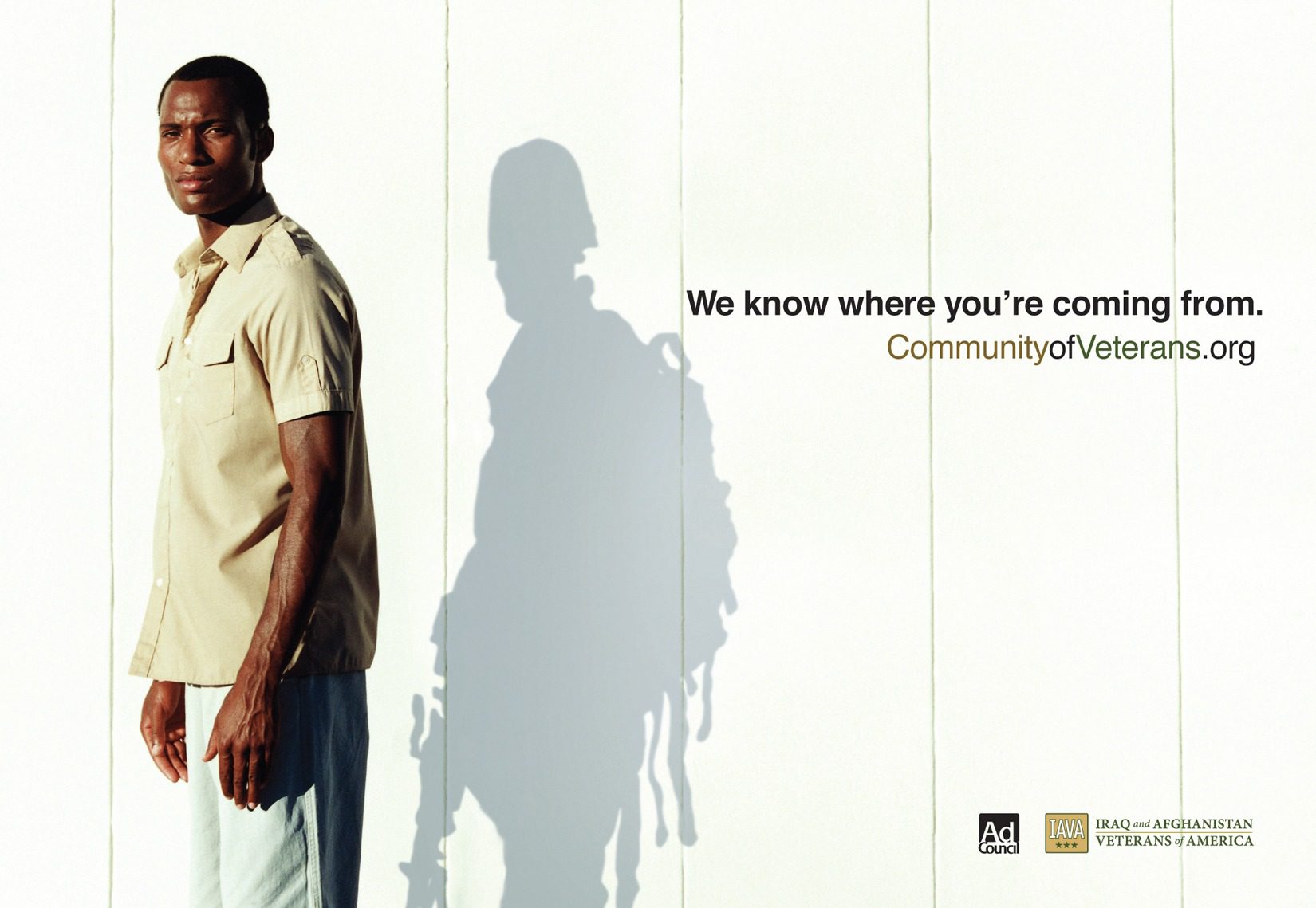 CommunityOfVeterans.org. We know where you're coming from. Man standing next to wall with shadow of a soldier.