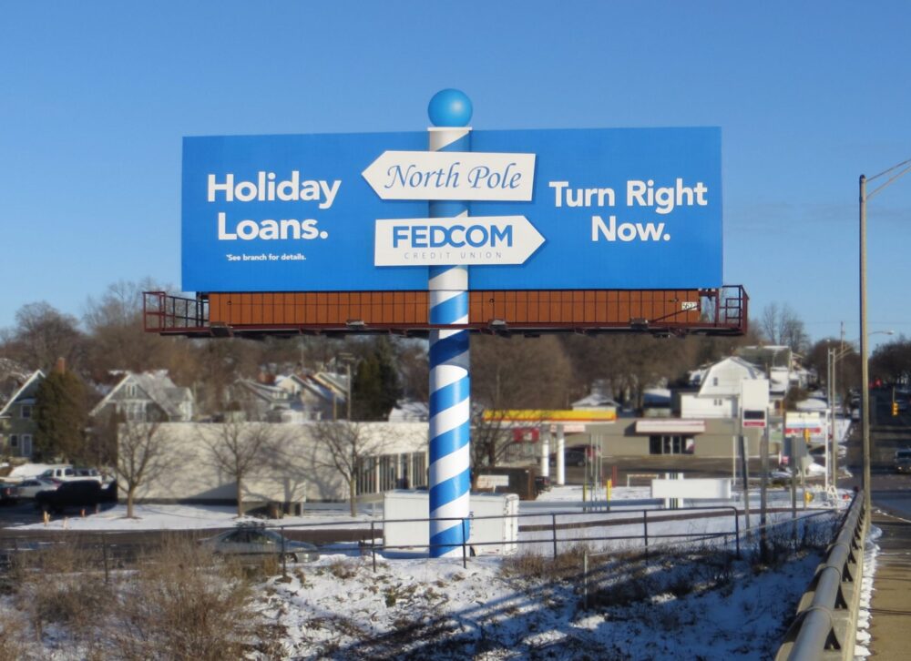 FEDCOM Credit Union. Holiday Loans design with pole wrap of a blue spiral like the north pole.