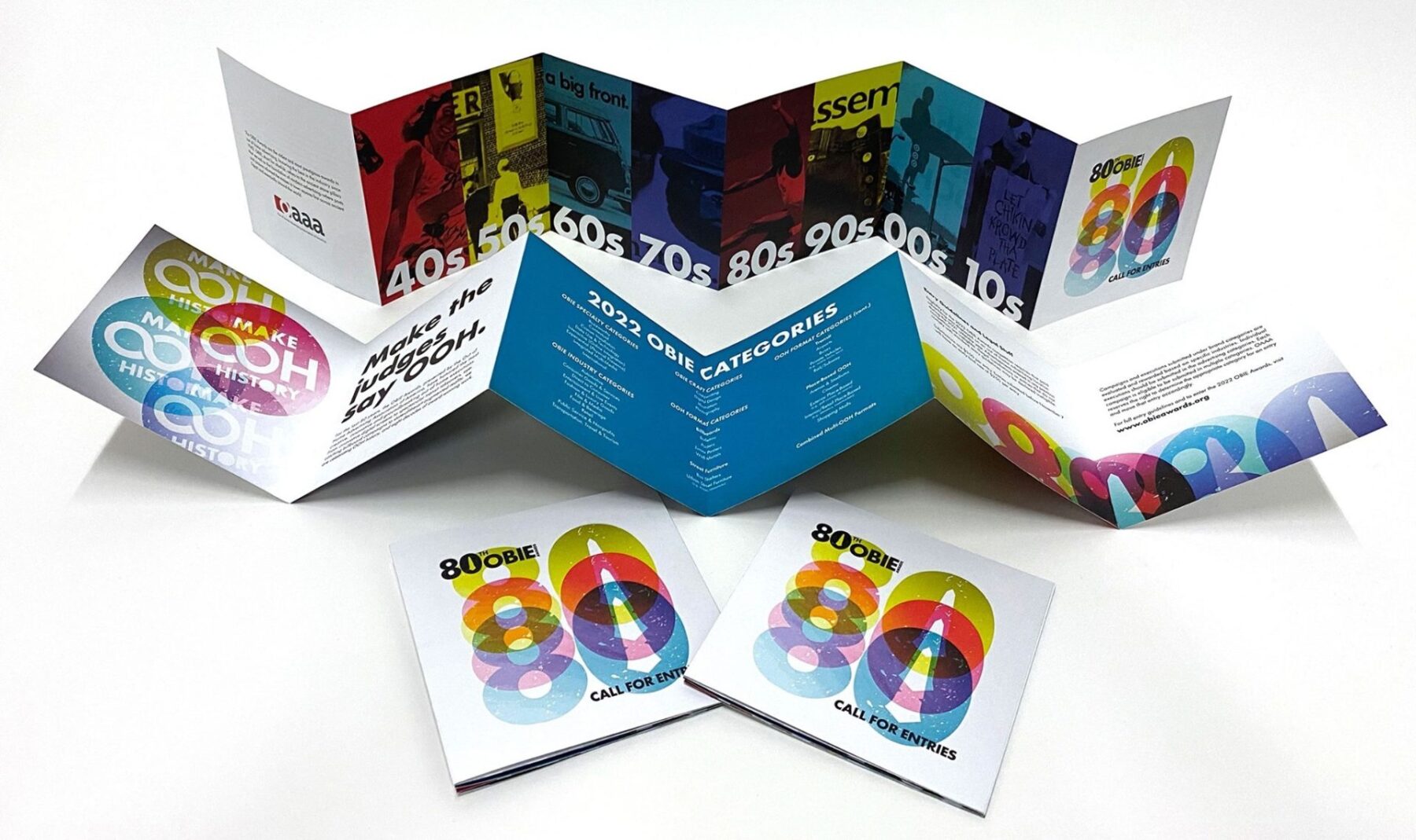 Accordion fold pamphlet with an illustrated “80” and an Obie Award in bright colors repeated, along with information about the award show
