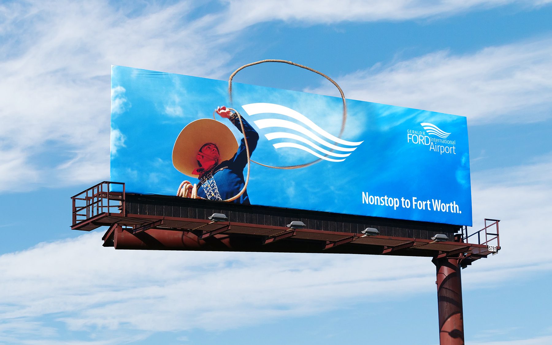 Billboard of a cowboy with a lasso, the lasso extends outside of the board, and the headline “Nonstop to Fort Worth.”
