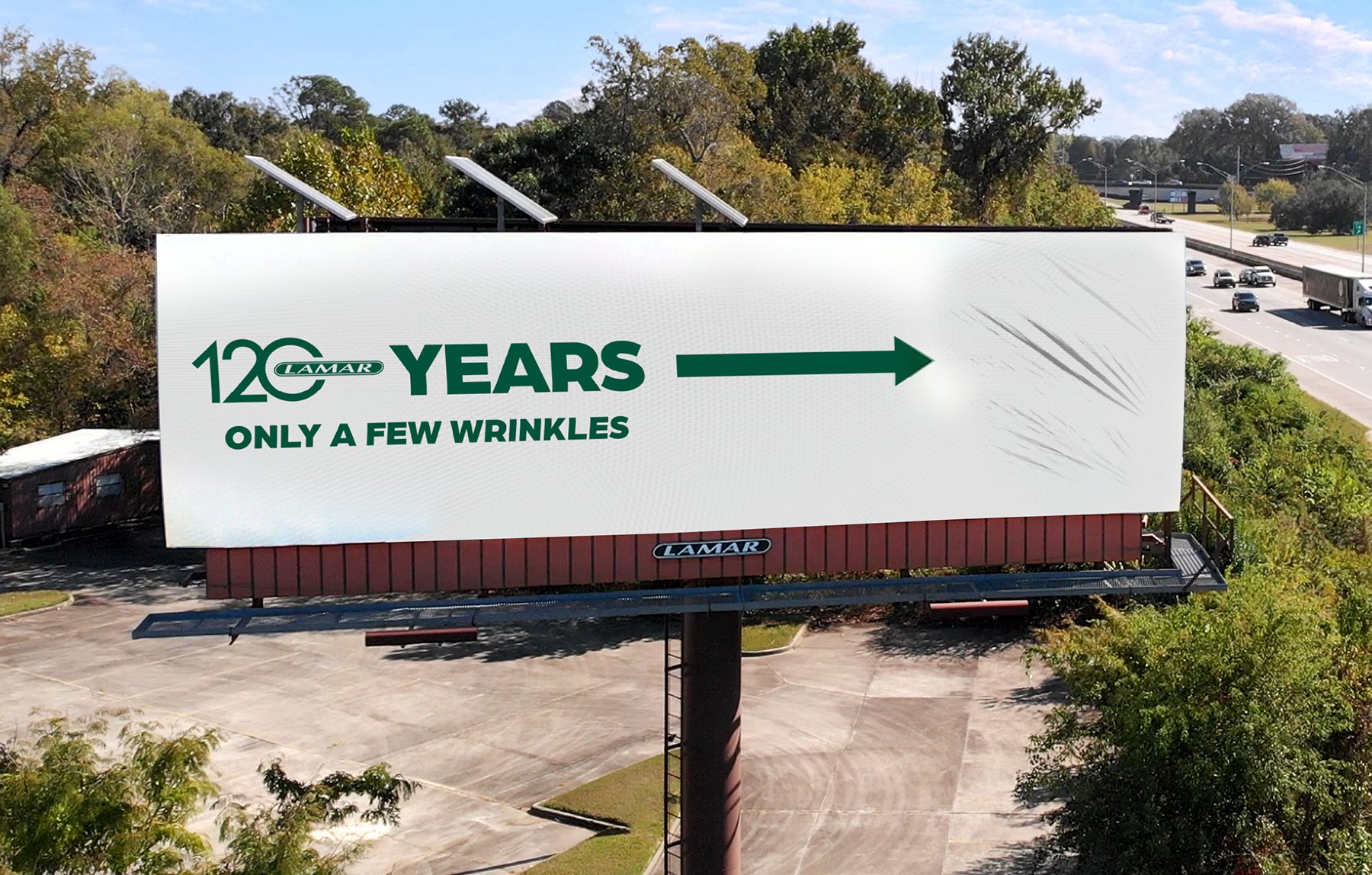 Billboard designed for Lamar made to look like it’s wrinkled with the headline, “120 years only a few wrinkles.”