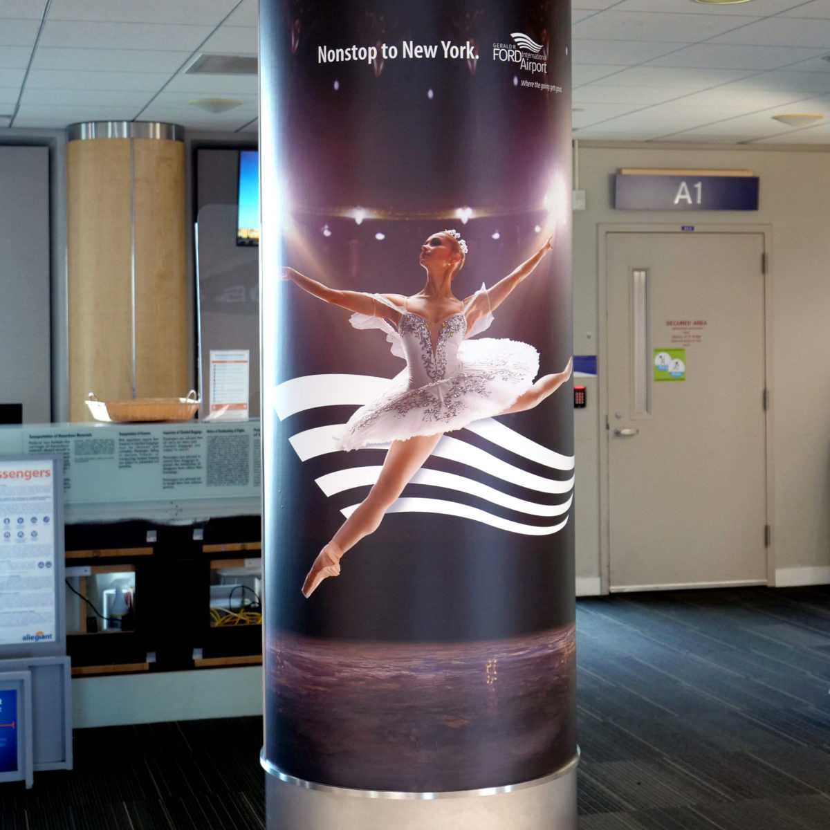 Column wrap with a ballet dancer with the line, “nonstop to New York.”