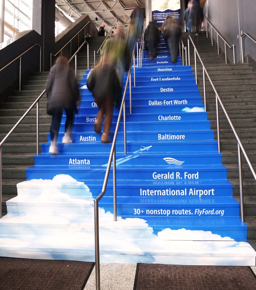 Non-traditional out of home stair decals promoting nonstop routes