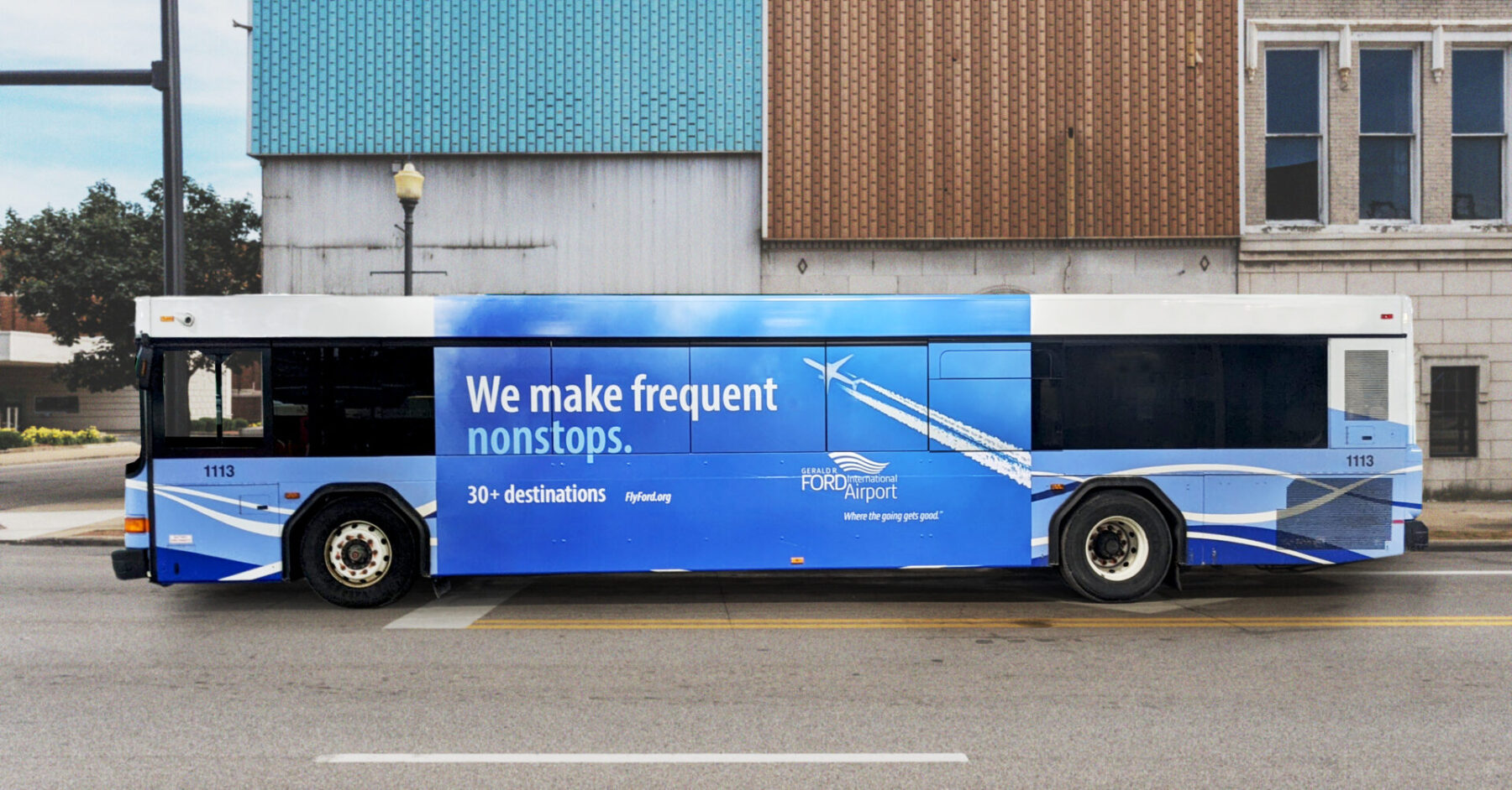 Bus out of home advertisement with headline "We make frequent nonstops"