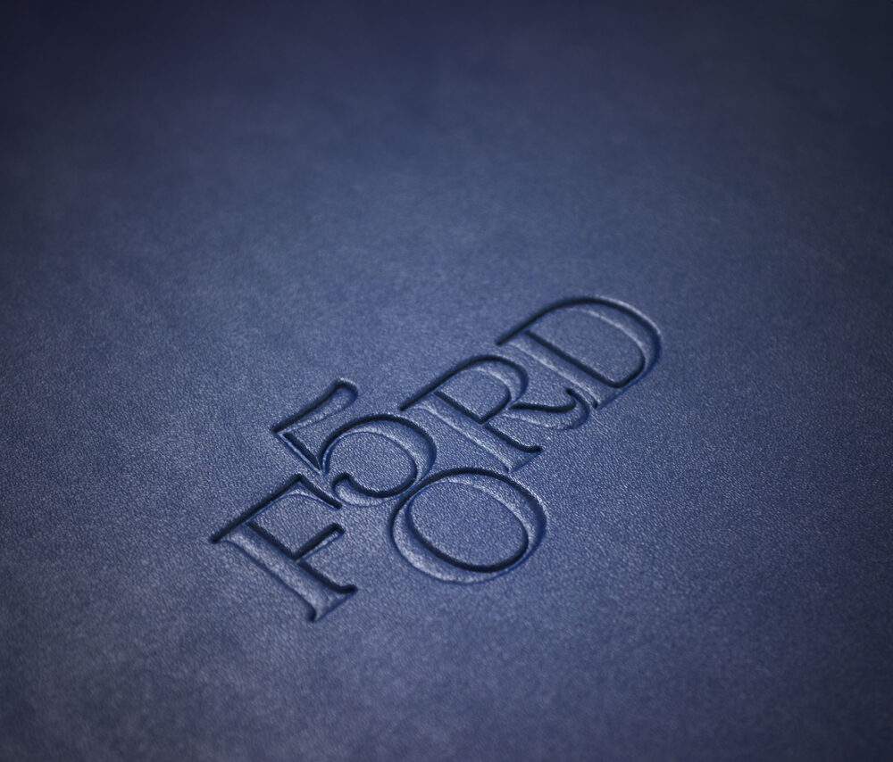 Close up of Ford 50 logo on print materials