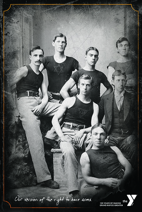 Poster with black and white historic photograph of several men wearing tank tops and headline "Our version of the right to bear arms"