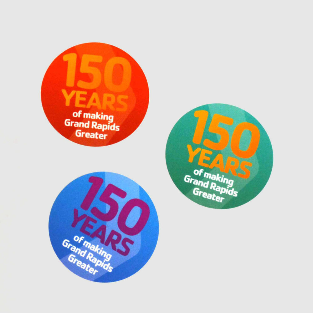 Stickers with headline "150 years of making Grand Rapids Greater."