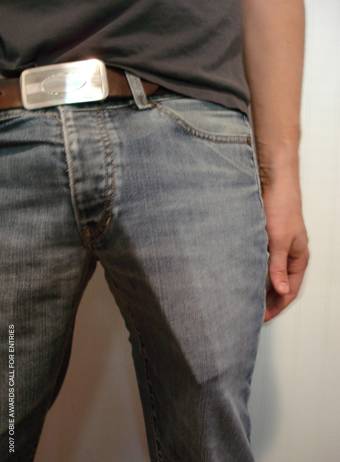 Poster featuring an image of a man in jeans with an Obie award in his pocket, and the headline, “2007 obie awards call for entries.”