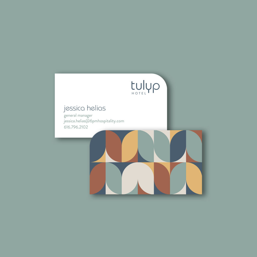 Business card designed for Tulyp Hotel with a curved upper corner and the repeating tulip pattern.