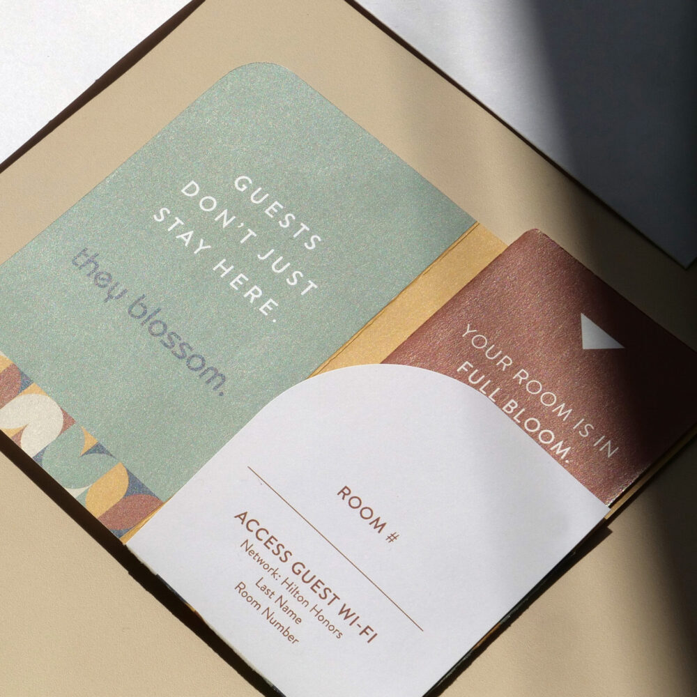 Room key packet designed for Tulyp Hotel featuring the lines, “Guests don’t just stay here, they blossom,” and “Your room is in full bloom.”