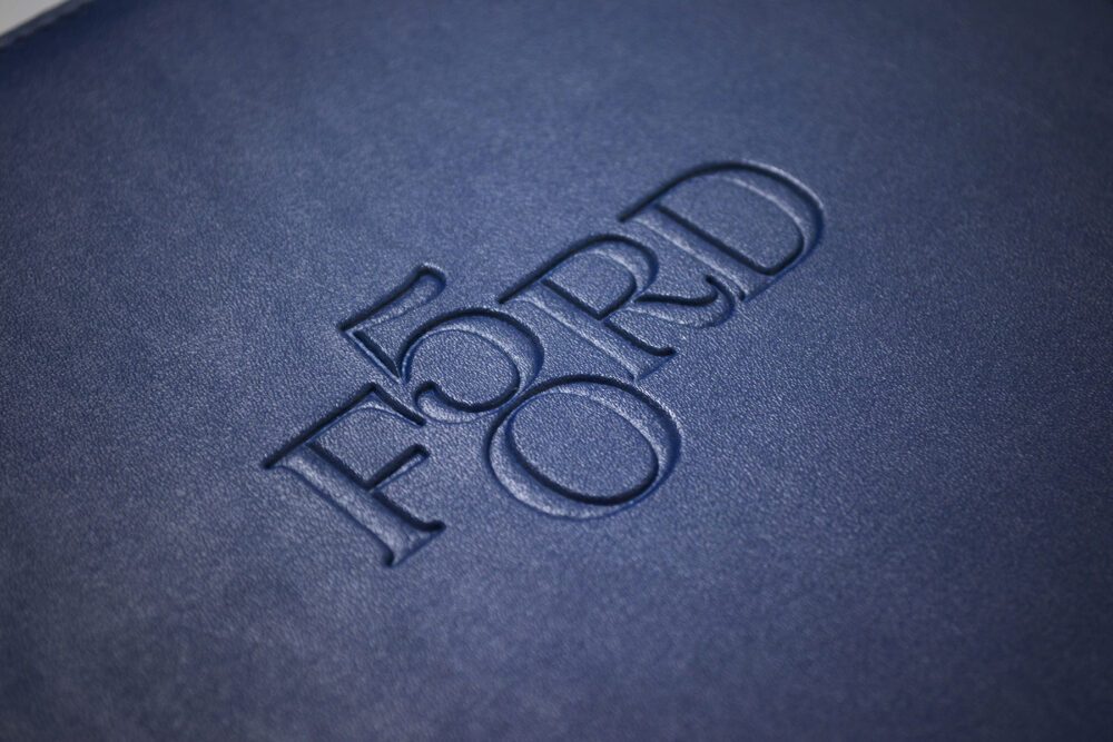 Close up of Ford 50 logo on print materials
