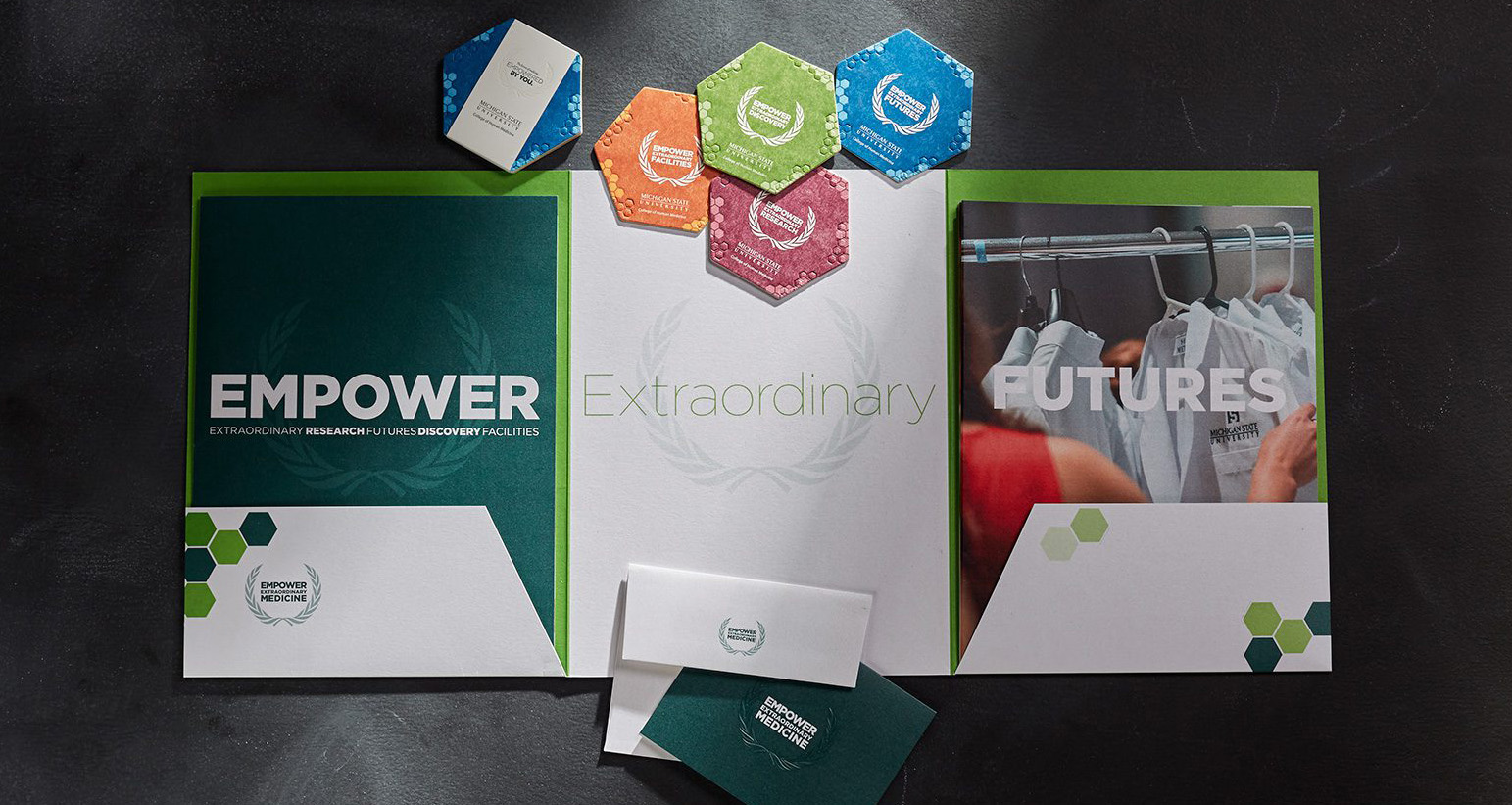 "Empower Extraordinary Futures" Capital Campaign pocket folder, inserts, envelope, and coasters.