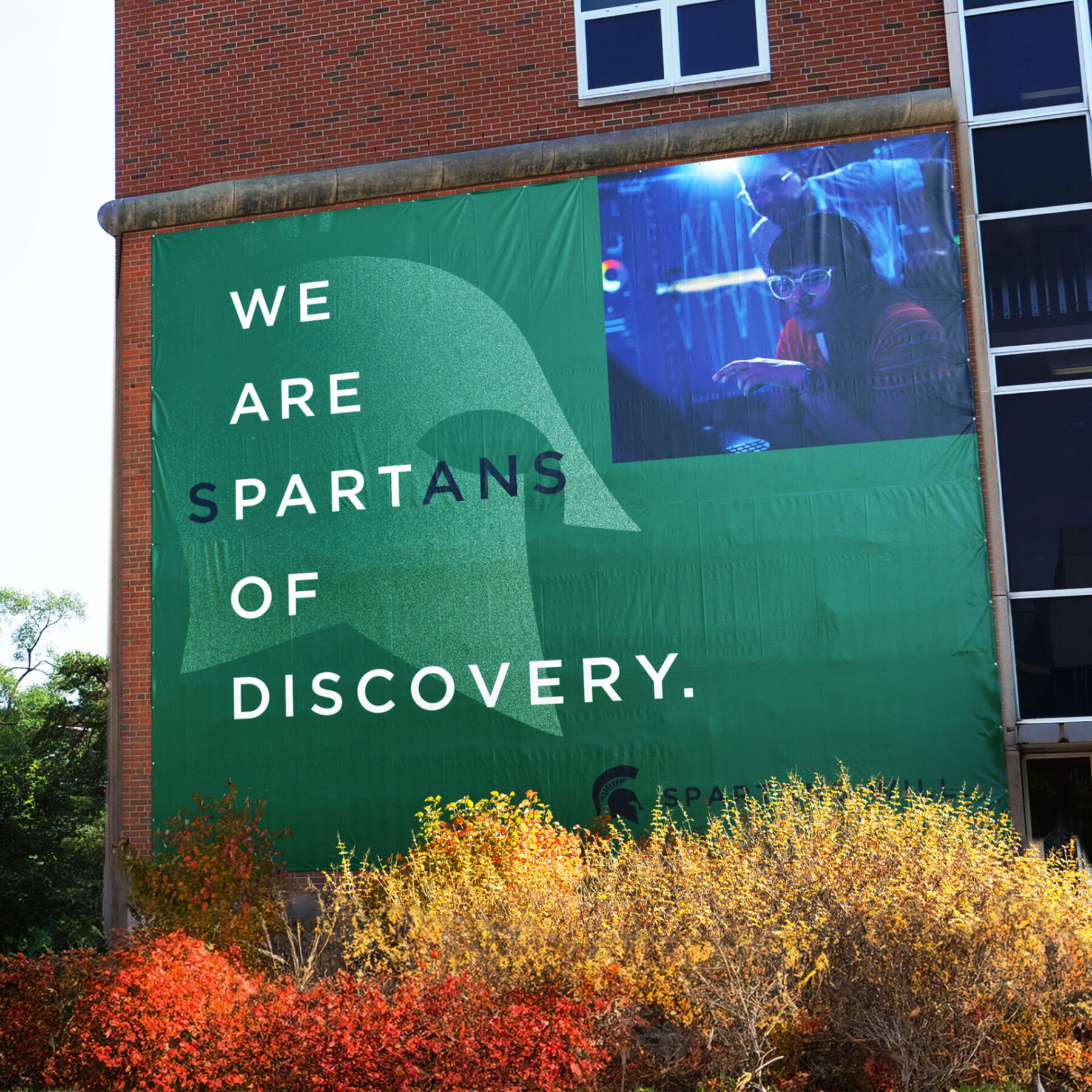 Building banner with headline "We are Spartans of discovery"