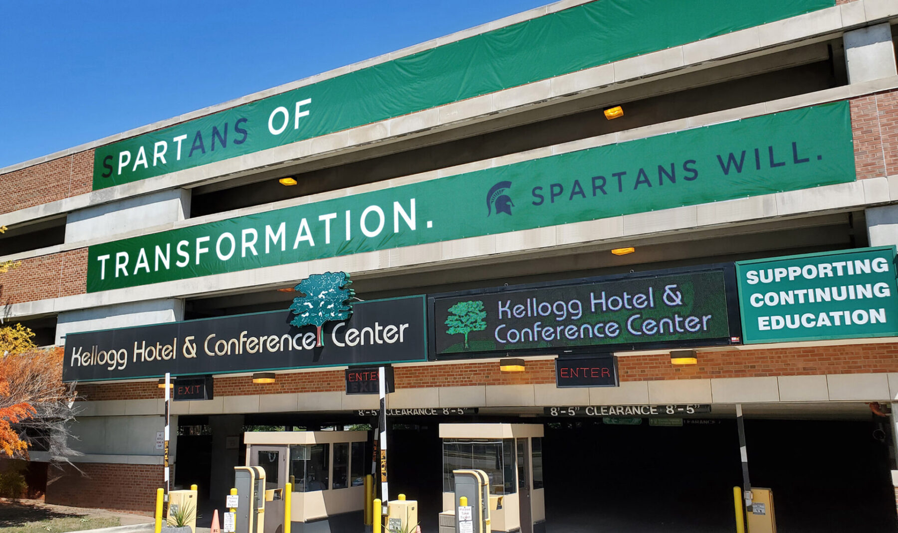 Parking garage banners with headline "Spartans of transformation"