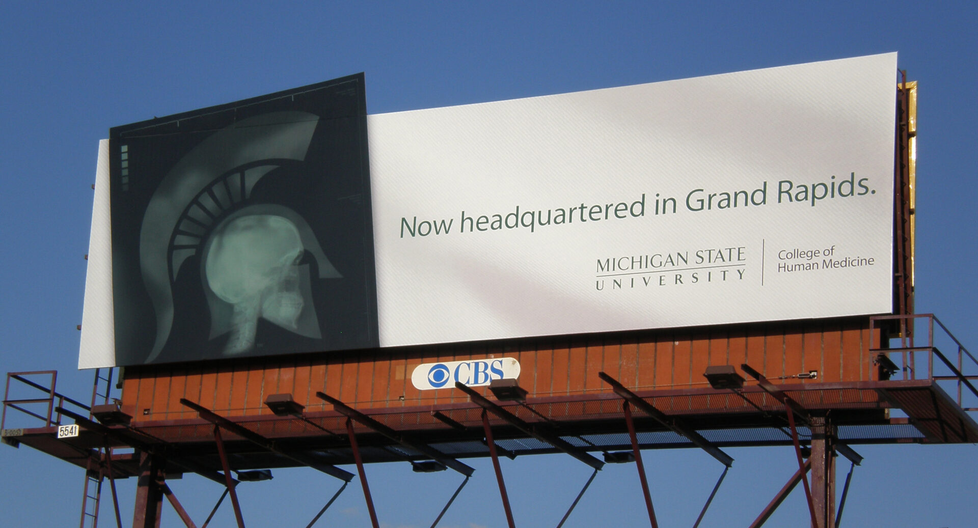 "Now headquartered in Grand Rapids." out of home bulletin.