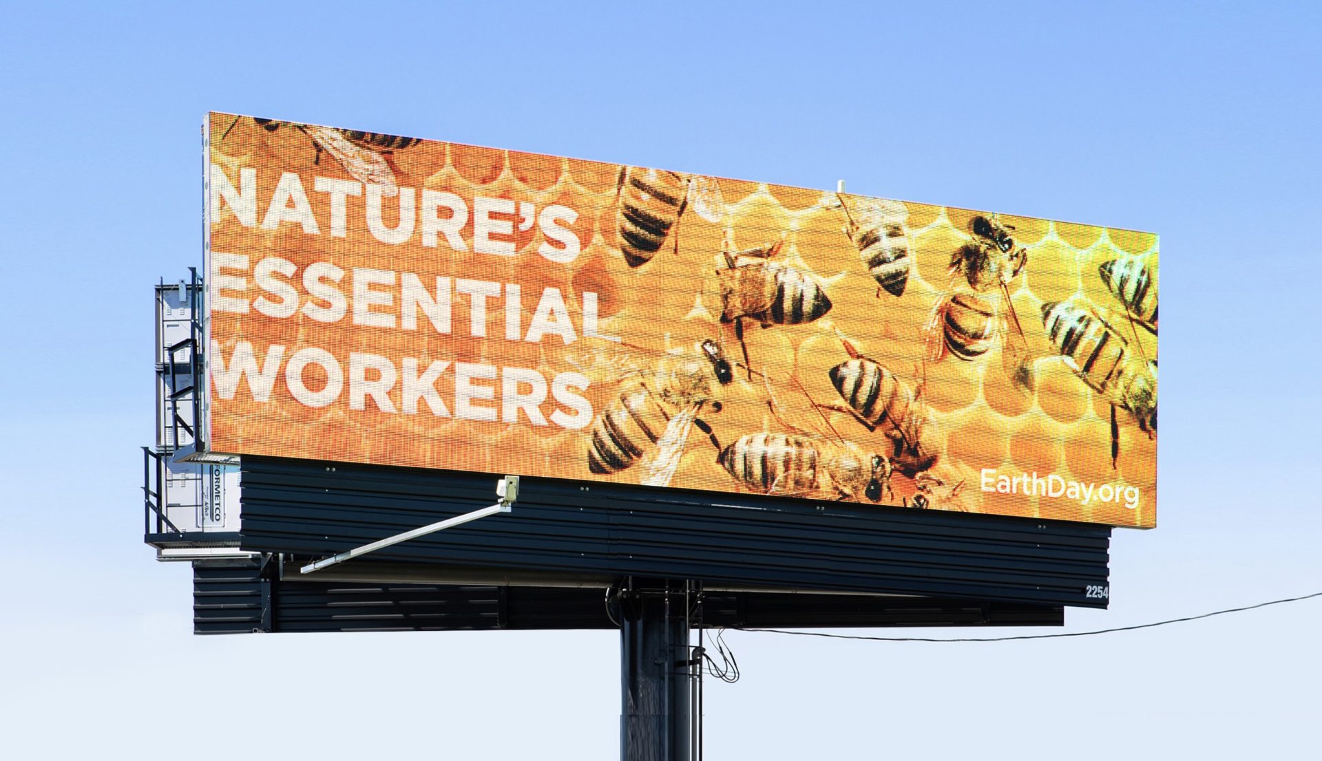 Out of home bulletin for Earthday.org showing bees and headline "nature's essential workers"