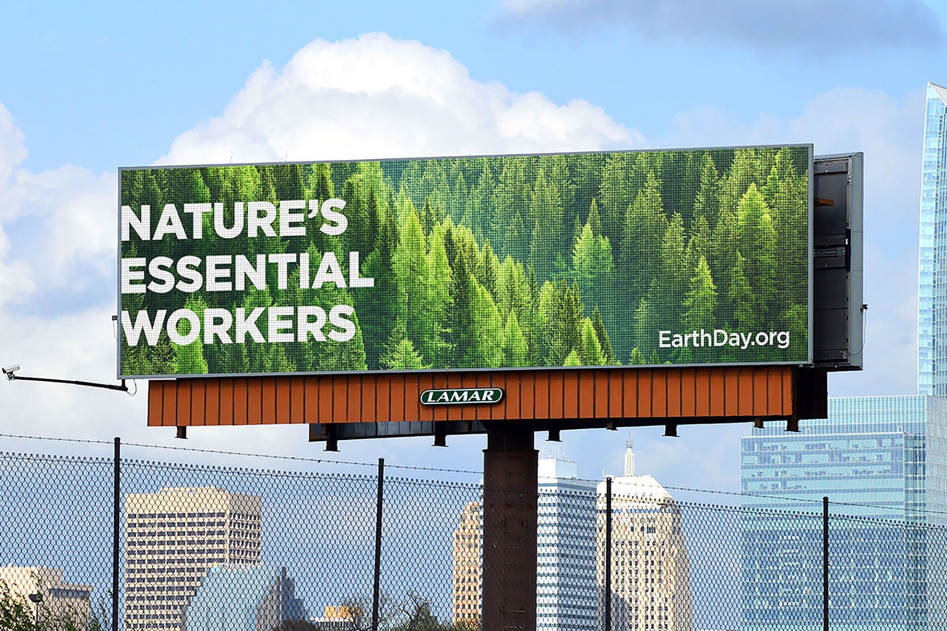 Out of home bulletin for Earthday.org showing trees and headline "nature's essential workers"