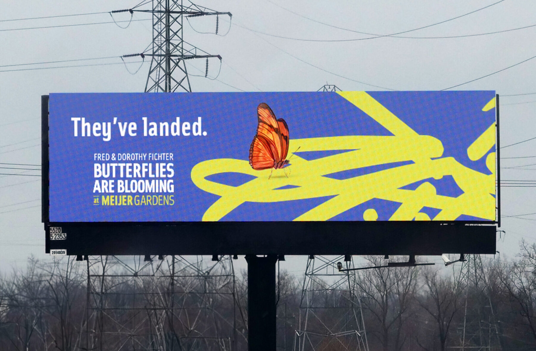 Billboard featuring an illustrated butterfly and the headline “They’ve landed.” Promoting the opening of the butterfly garden.